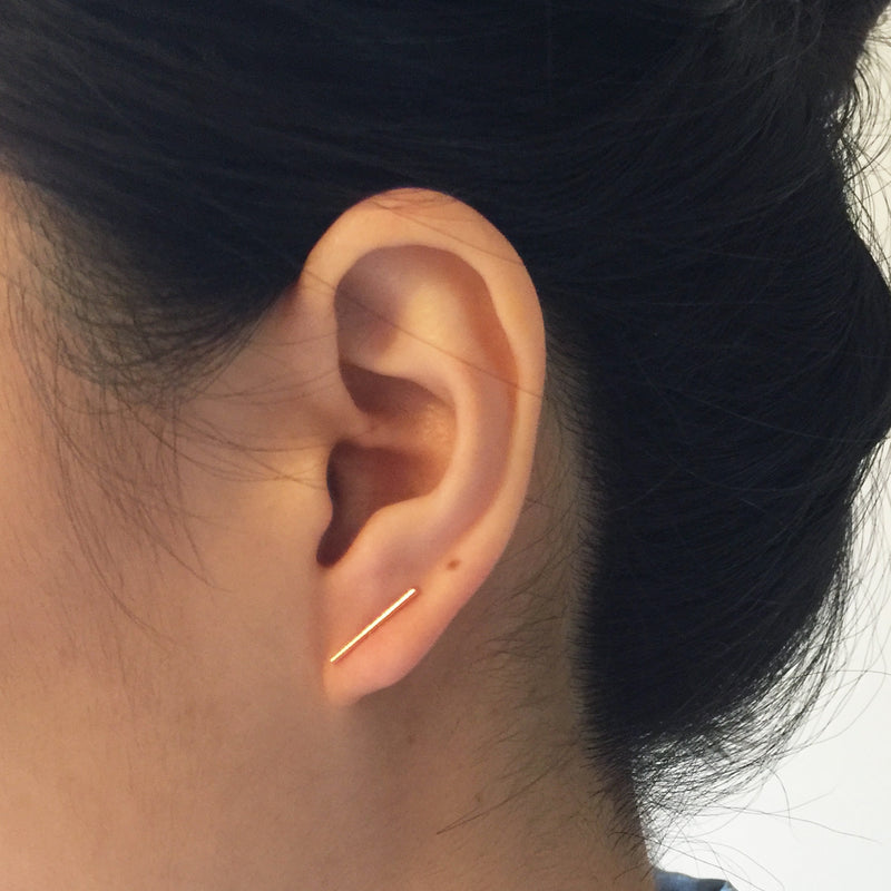 Model wearing Large Skinny Bar Earrings - Yellow gold