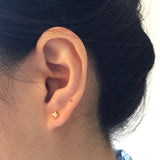 Model wearing Supernova Earrings - Yellow gold